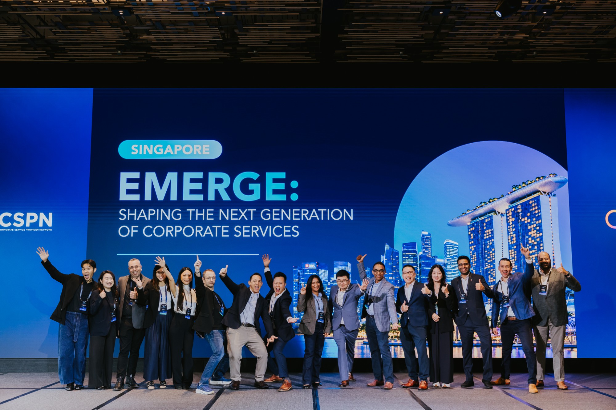 The organising team on stage at EMERGE, the Payoneer × CSPN Summit 2026